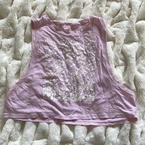 Lululemon light pink tank top with a floral type of design on the front